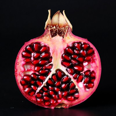 Cut Pomegranate on Black Background