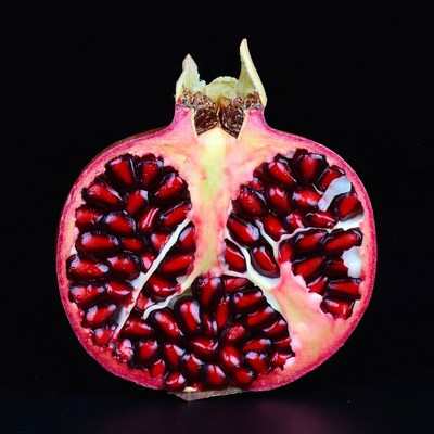 Cut Pomegranate on Black Background