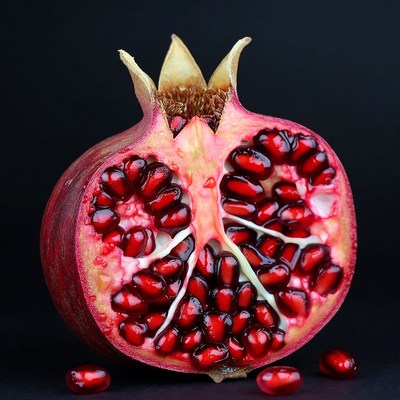 Cut Pomegranate on Black Background