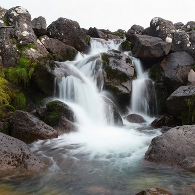 Waterfall cascading over mossy rocks