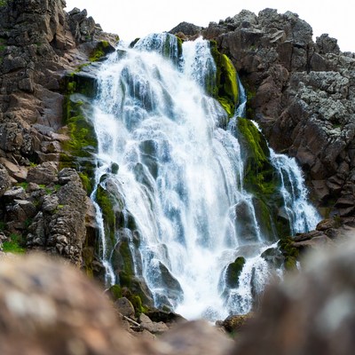 Waterfall cascading over mossy rocks