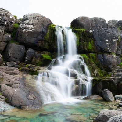 Waterfall cascading over mossy rocks