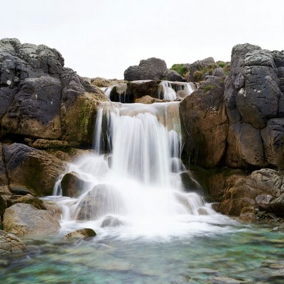 Waterfall cascading over mossy rocks