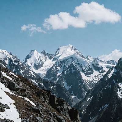Snowy Mountain Peaks Under Blue Sky