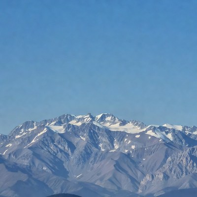 Snowy Mountains Under Blue Sky