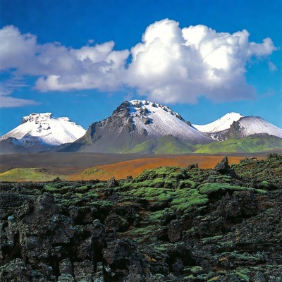 Snowy Mountains over Volcanic Landscape
