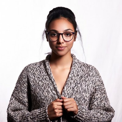 Young Asian woman in glasses and sweater