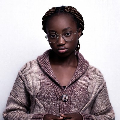 African-American girl with braids and glasses