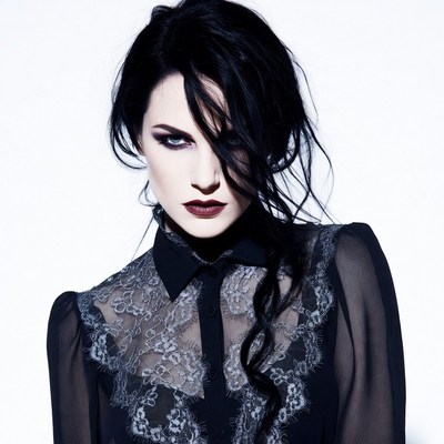 Woman with black hair and lace blouse