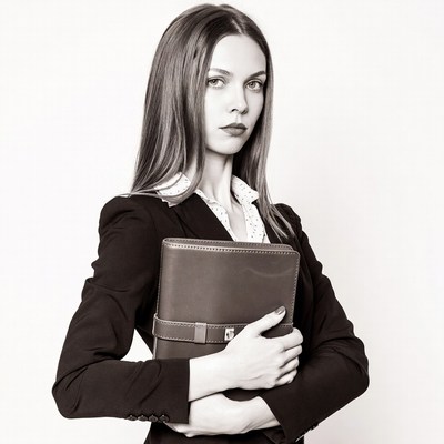 Woman holding leather notebook