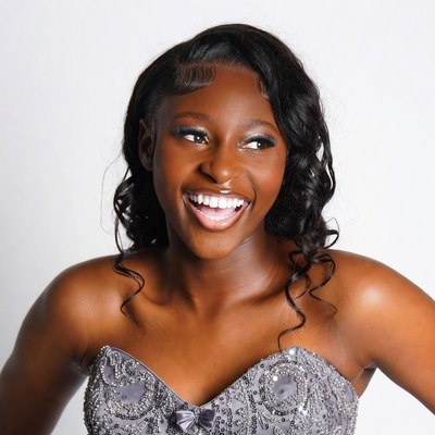Smiling African-American woman in silver dress