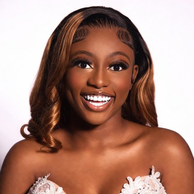Smiling Black woman in lace top