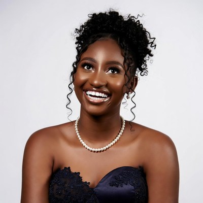 Smiling Black woman in navy gown