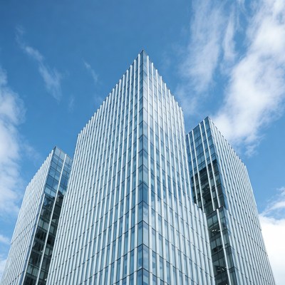 Modern Glass Skyscrapers Against Blue Sky