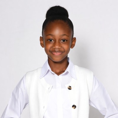 African-American girl in white vest smiling