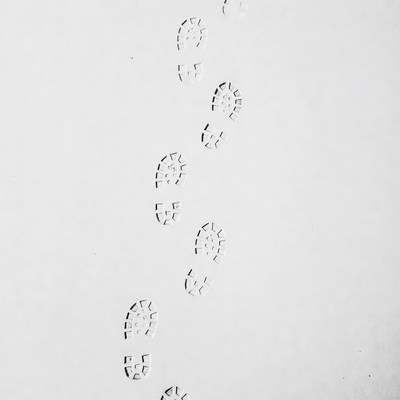 Footprint trail on white background