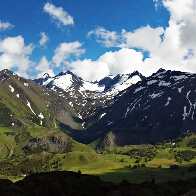 Snow-capped Mountains in Green Valley