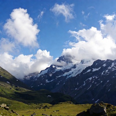 Snowy Mountain Peak with Clouds