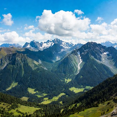 Snow-capped Mountains and Green Valley