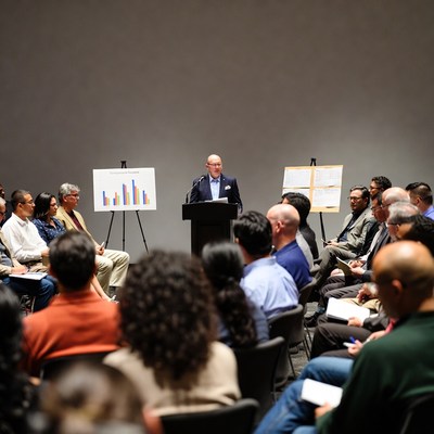 Man presenting charts in business meeting
