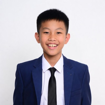 Asian boy smiling in navy suit