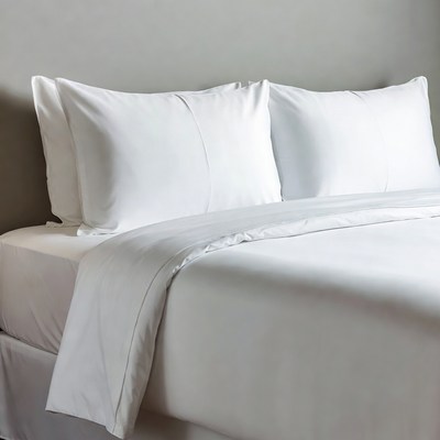White pillows on made bed