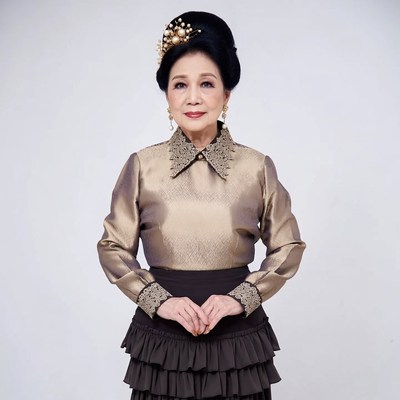 Asian woman in gold traditional dress