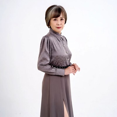 Asian woman in gray blouse skirt
