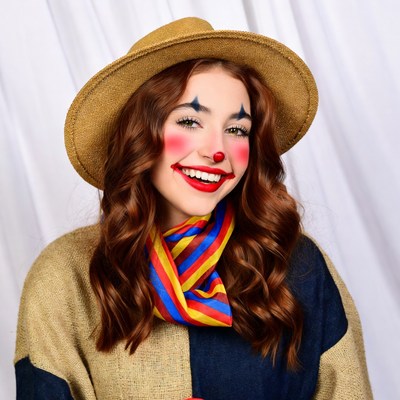 Woman in clown makeup smiling