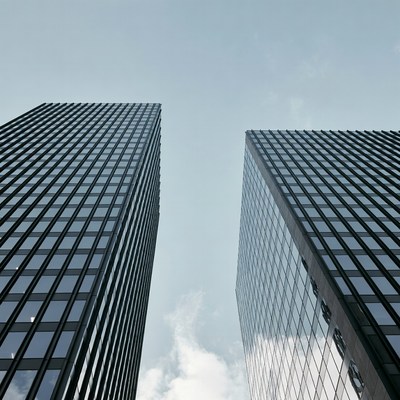 Two Tall Skyscrapers Against Sky