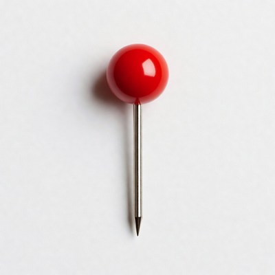 Red push pin on white background