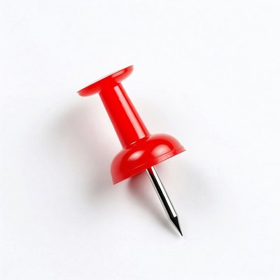 Red push pin on white