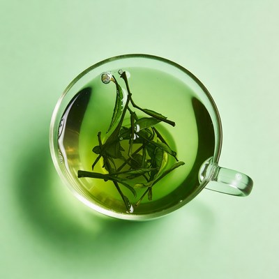 Green Tea Leaves in Glass Cup