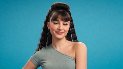 Woman with bangs and curls smiling