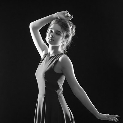 Woman posing with arms raised