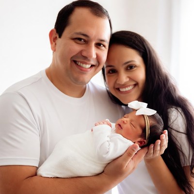 Parents holding newborn baby