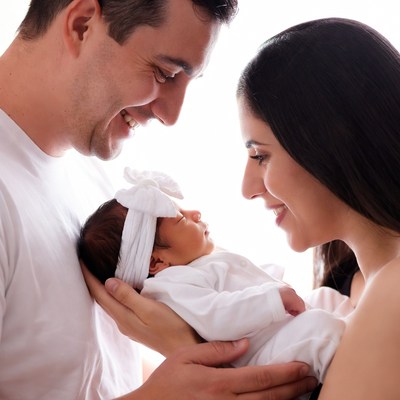 Parents holding newborn baby