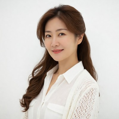 Asian woman in white blouse smiling