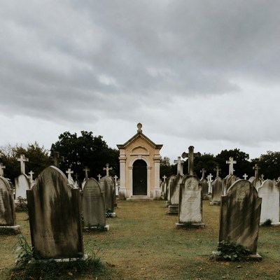 Mausoleum in foggy cemetery