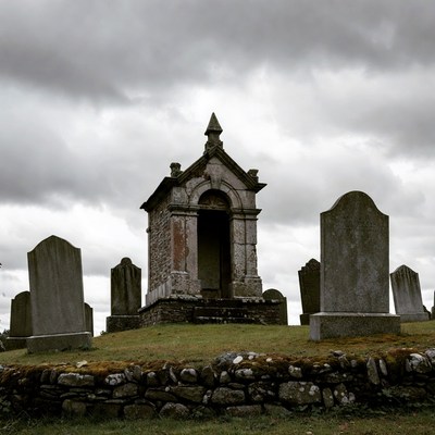 Old Mausoleum in Foggy Graveyard