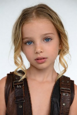 Blonde girl in leather vest