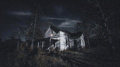 Abandoned haunted house in dark woods