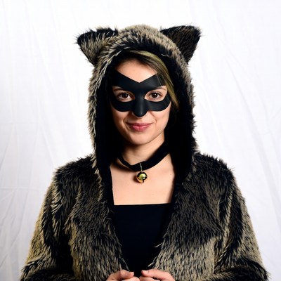Woman in raccoon costume mask