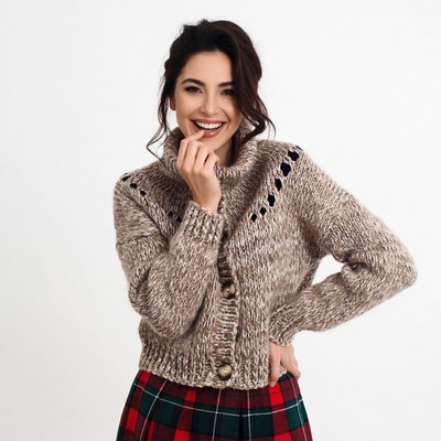 Smiling woman in knit sweater plaid skirt