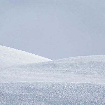 Snowy Hills Under Gray Sky