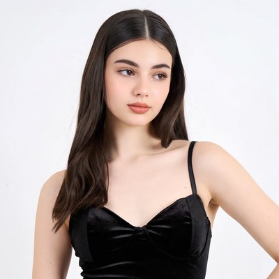 Young woman in black velvet top