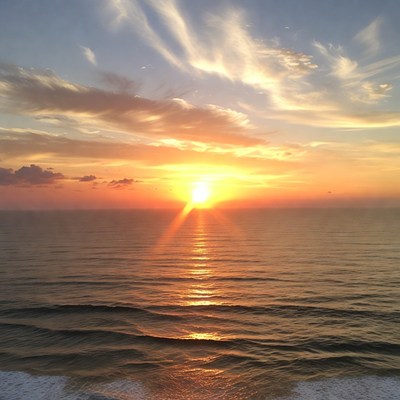 Sunset over ocean waves