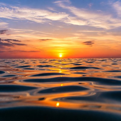 Sunset over ocean waves