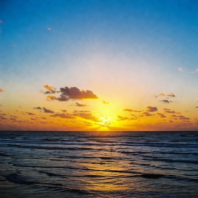 Sunset over ocean waves