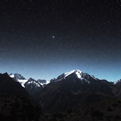 Snowy Mountains Under Starry Night Sky